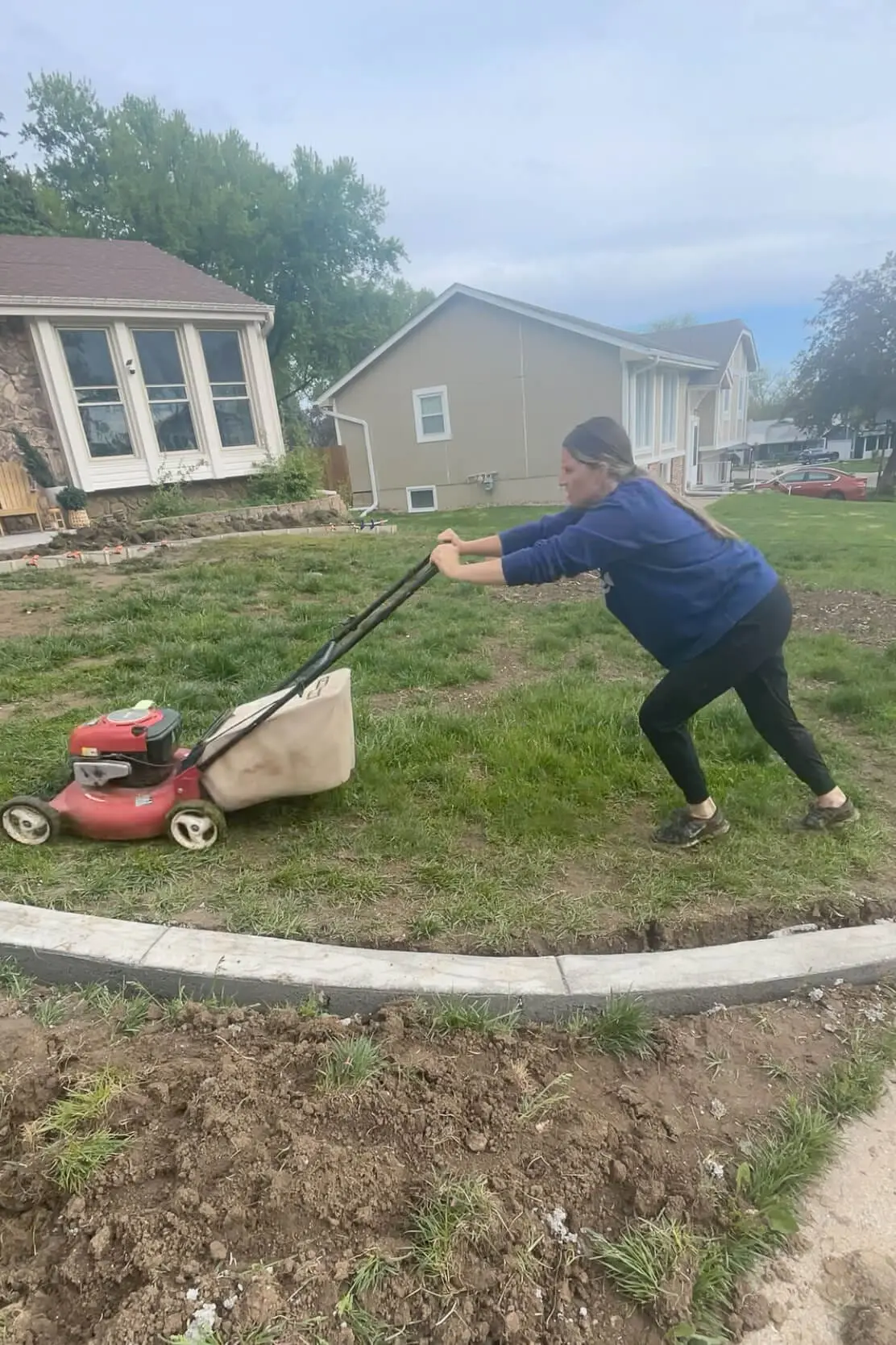 Removing old grass to get ready for laying sod.